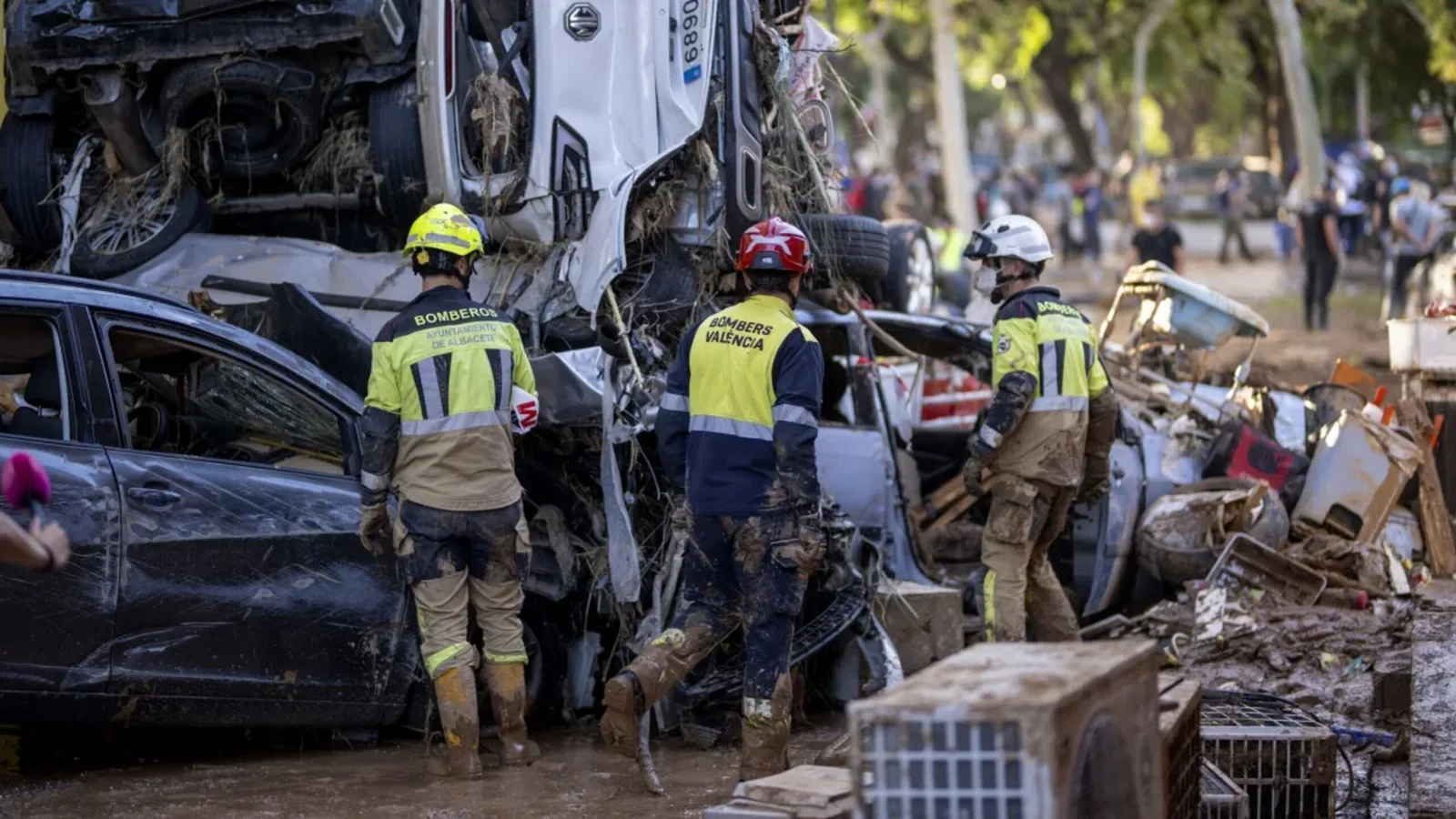 Firefighters search for people among cars in Alfafar, Valencia, on November 2. Lorena Sopêna/Europa Press/AP