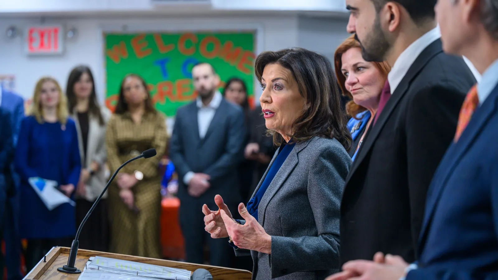 Governor Kathy Hochul speaks at a podium in a classroom setting. Copyright: Flickr Gov Kathy Hochul