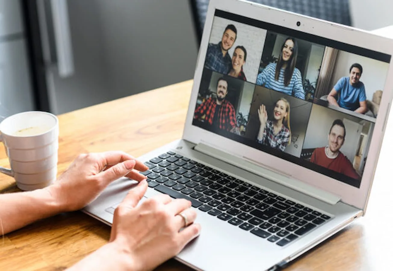 Video meeting on laptop screen, zoom app